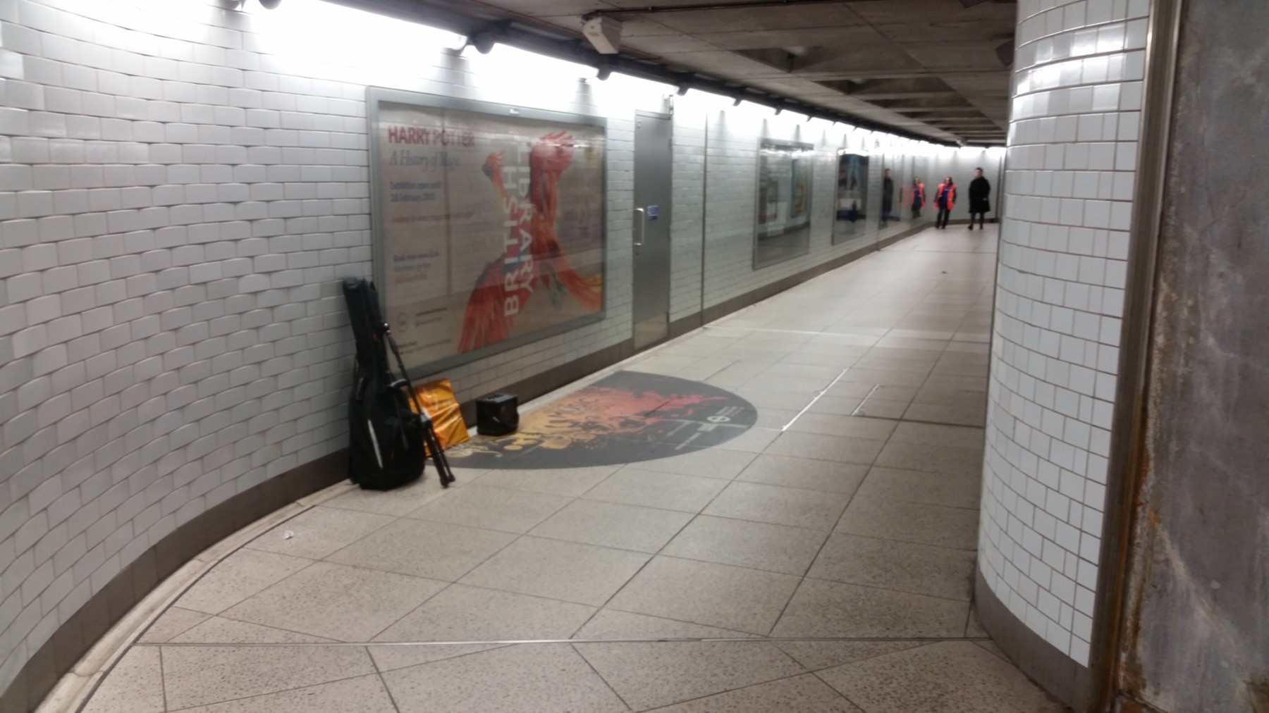 The pitch. It is in a tunnel which is not behind ticket barriers. It's semi-exposed to the elements.