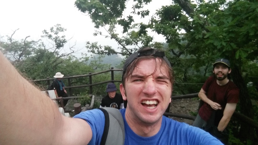 A satisfied, sweaty selfie after reaching the 836m peak of baegundae in Bukhansan park. (My friend Rich in the background)